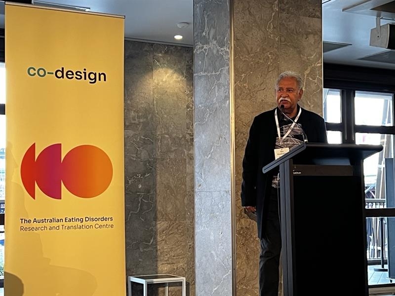 Image of Indigenous Elder Uncle Boe with a yellow co-design banner